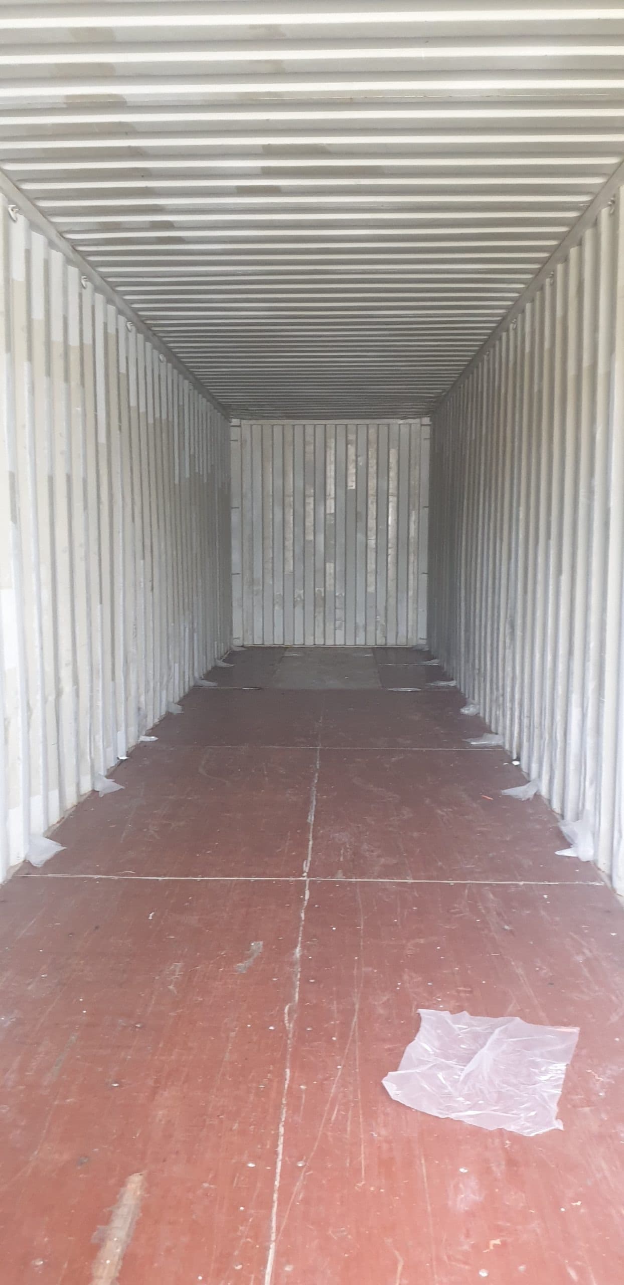 Second hand shipping containers stacked at the yard